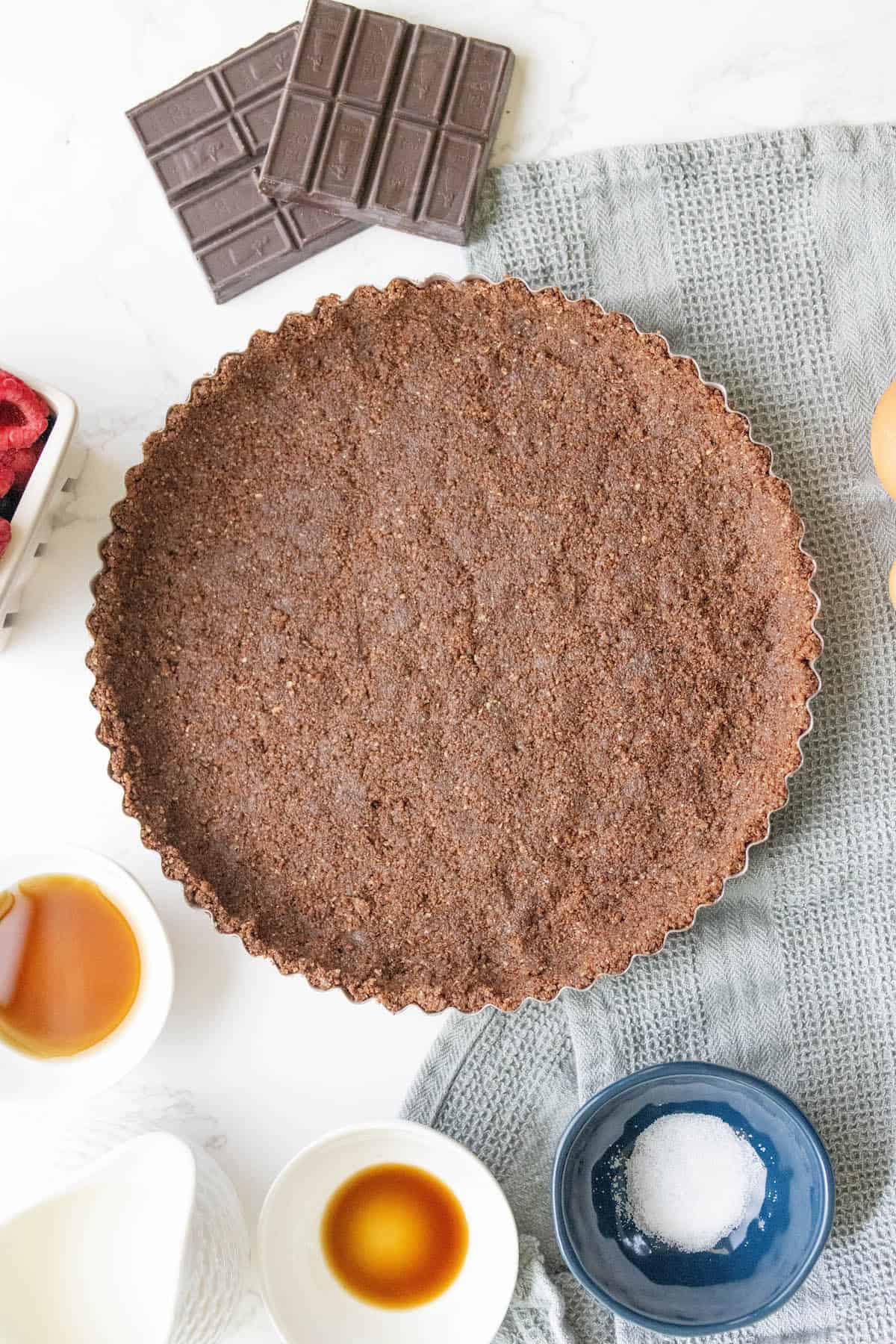 Silky chocolate tart on a table.