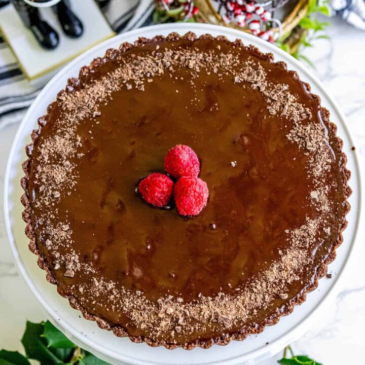 Silky chocolate tart with raspberries topping.
