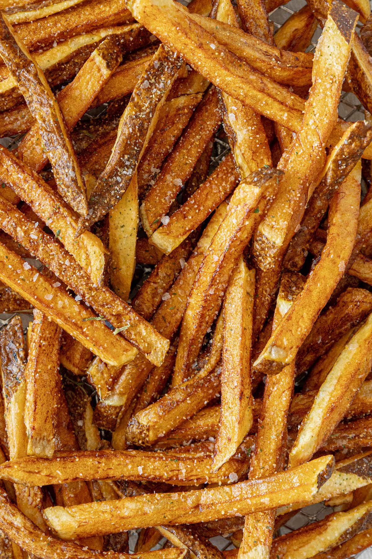 Sweet potato fries on a baking sheet.