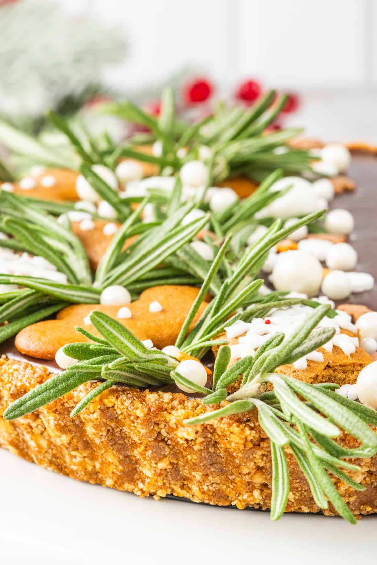 A gingerbread tart with rosemary sprigs on top.