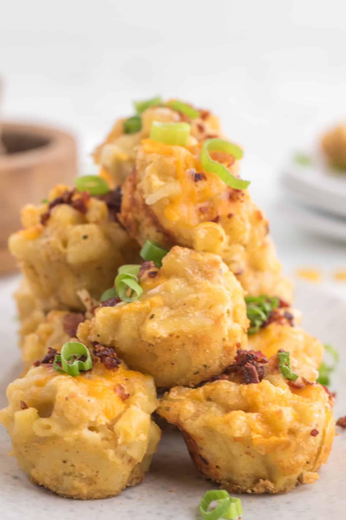 A stack of mac and cheese bites on a plate.