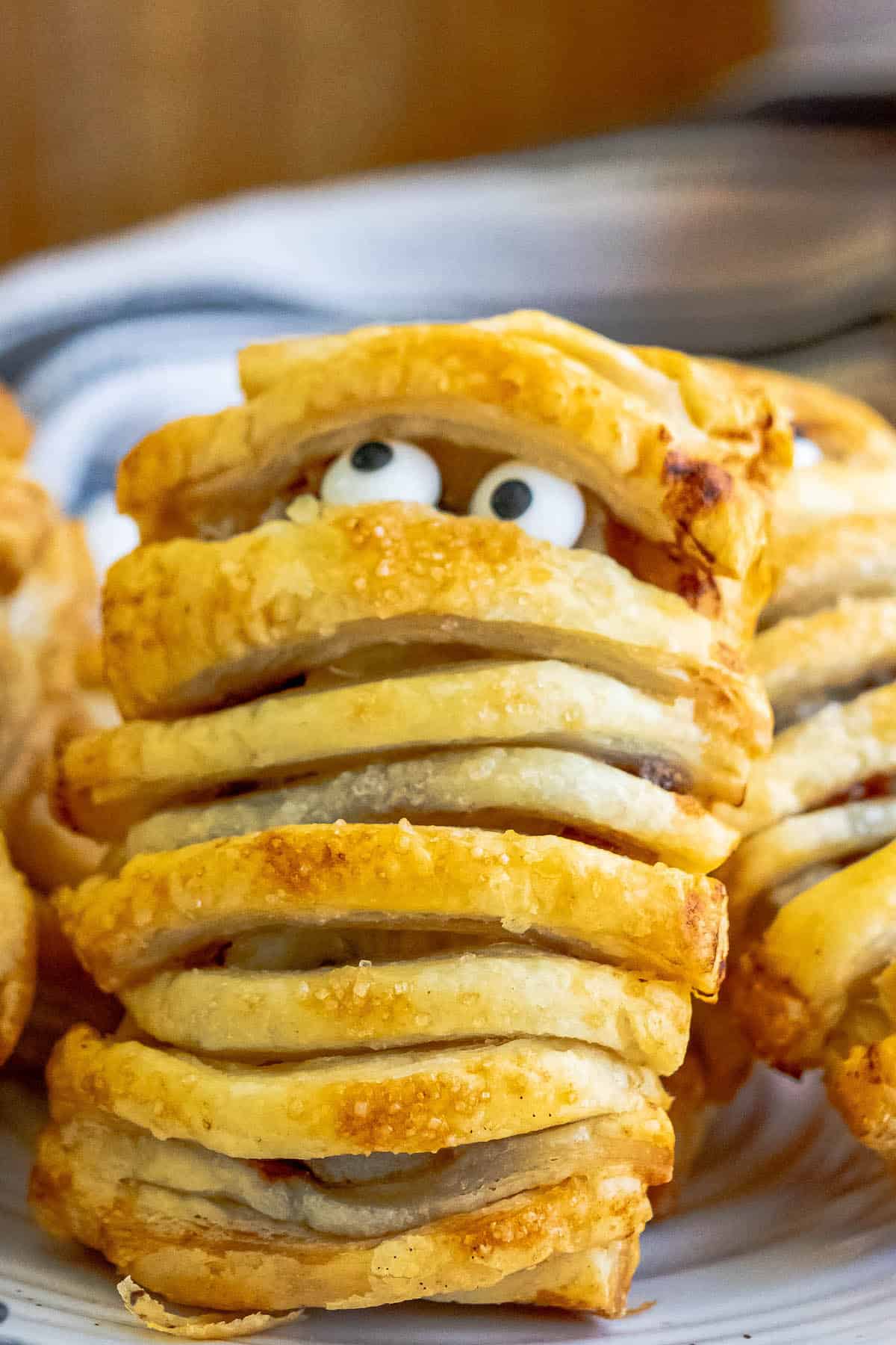 A plate of banana nutella mummies with eyes on them.