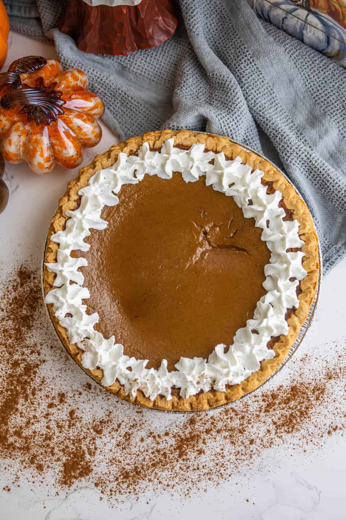 A pumpkin pie with whipped cream.