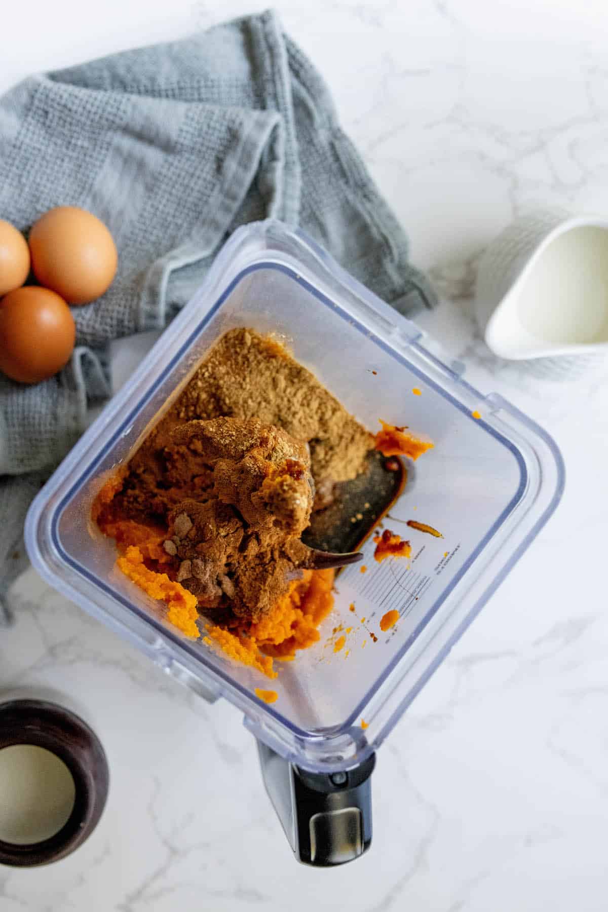 Sweet potato puree in a blender with eggs and pumpkin pie ingredients.