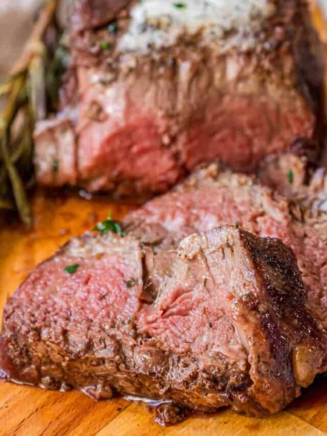 Steak on a wooden cutting board.