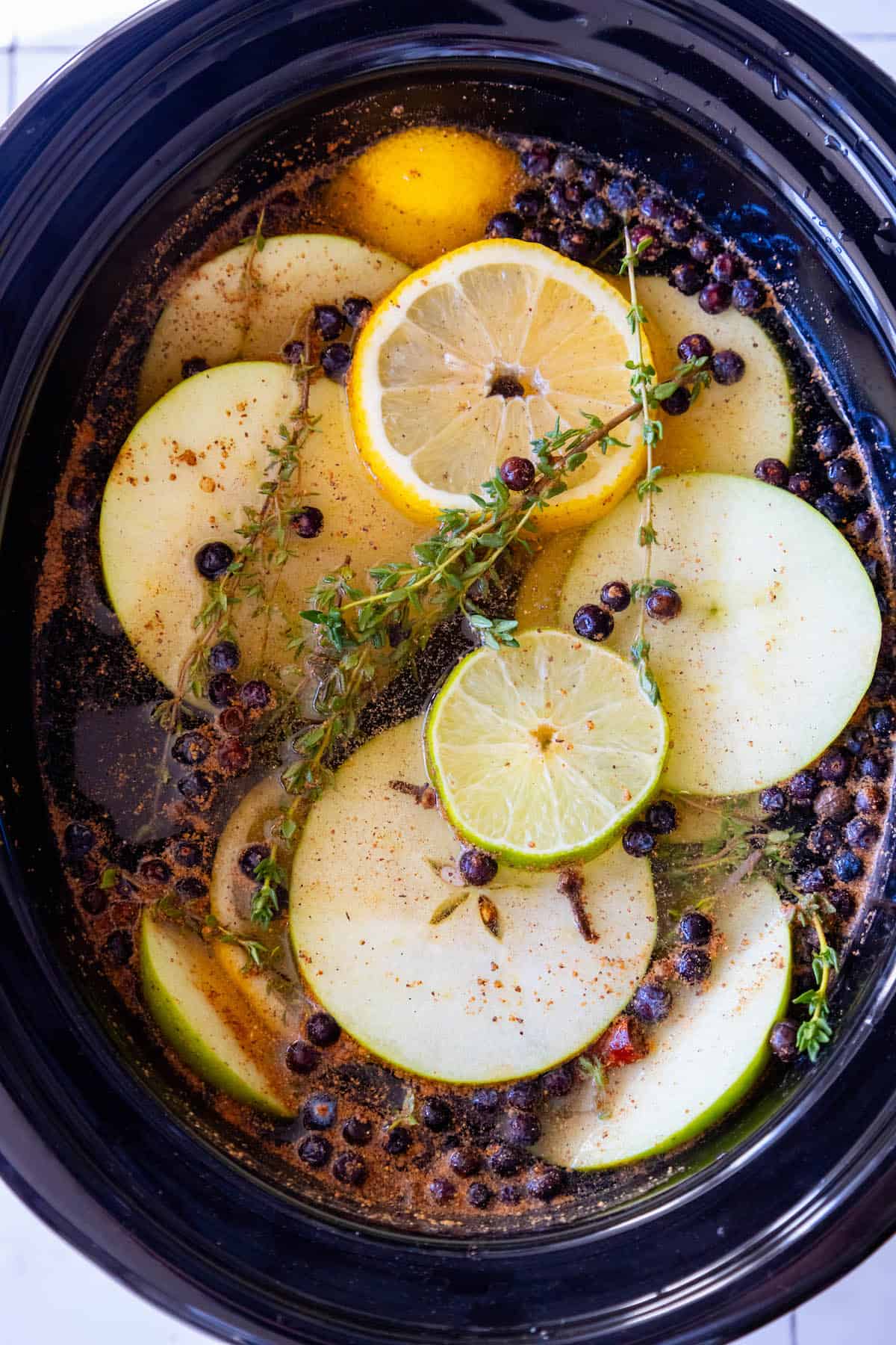 A crockpot filled with holiday potpourri.