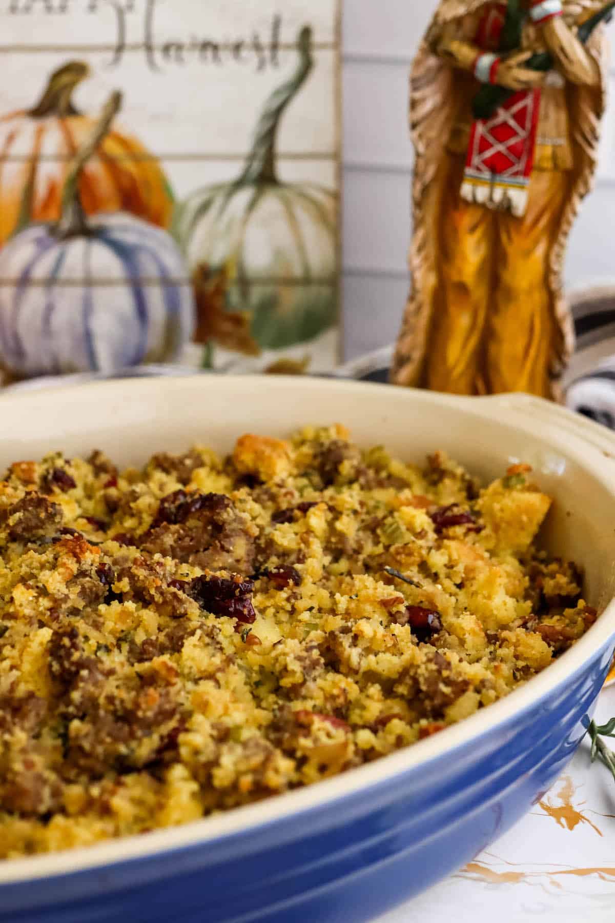 Thanksgiving sausage stuffing in a blue and white dish.