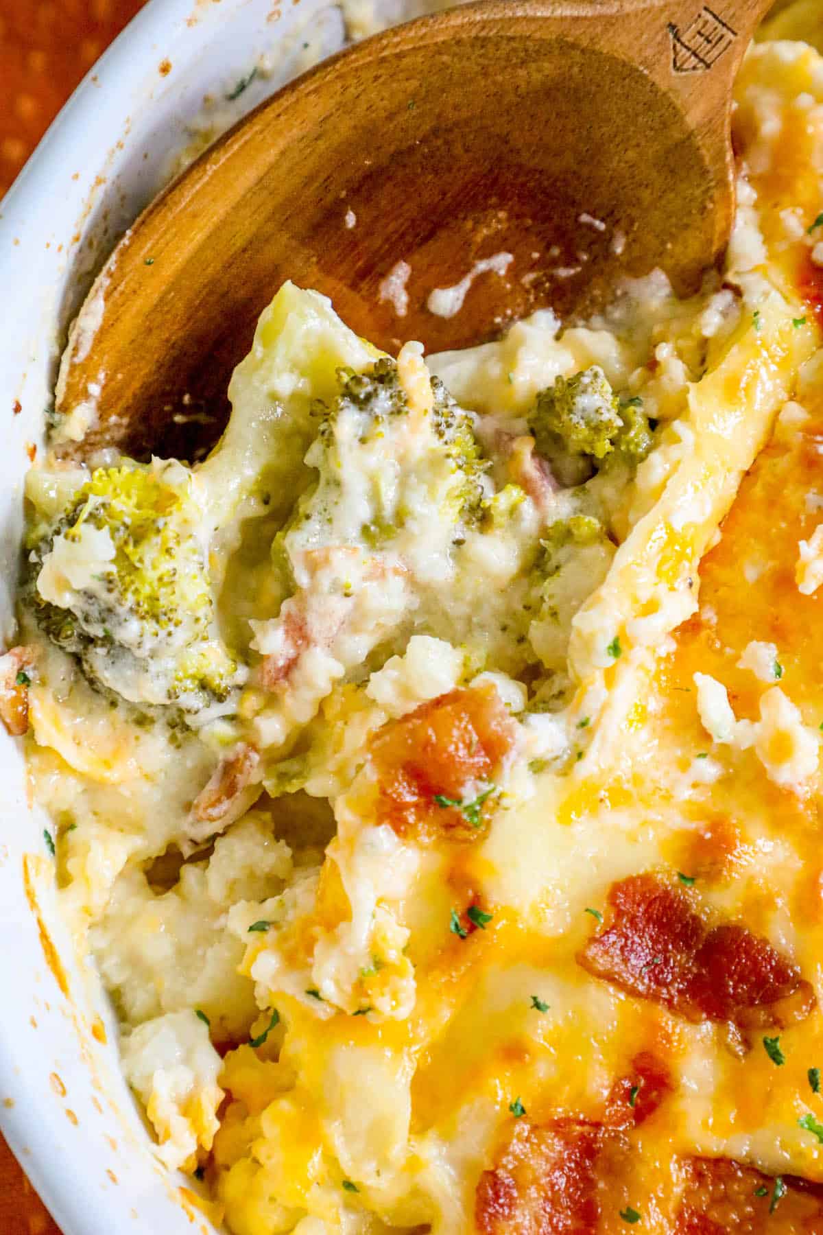 A broccoli and bacon casserole dish with cheese.