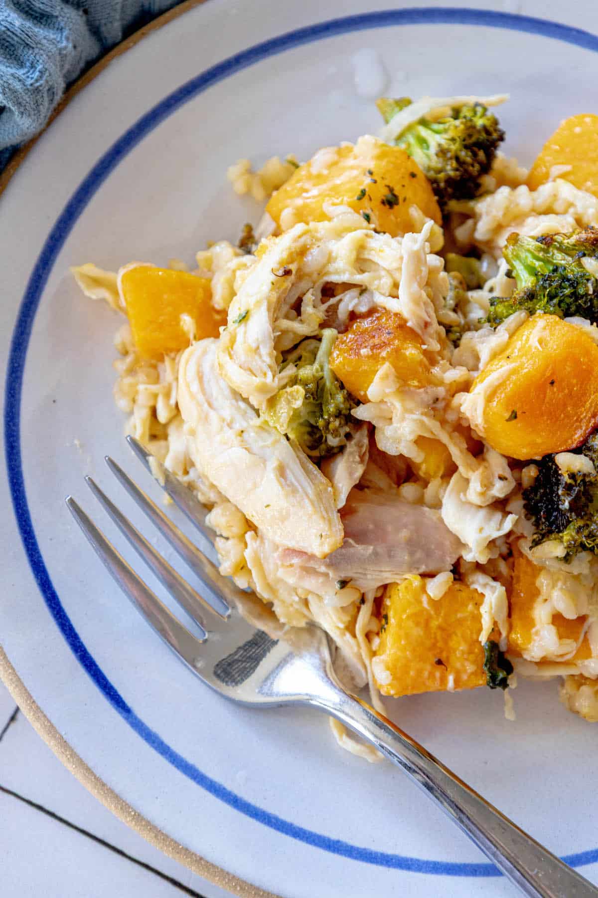 A plate with chicken, rice, and broccoli on it.