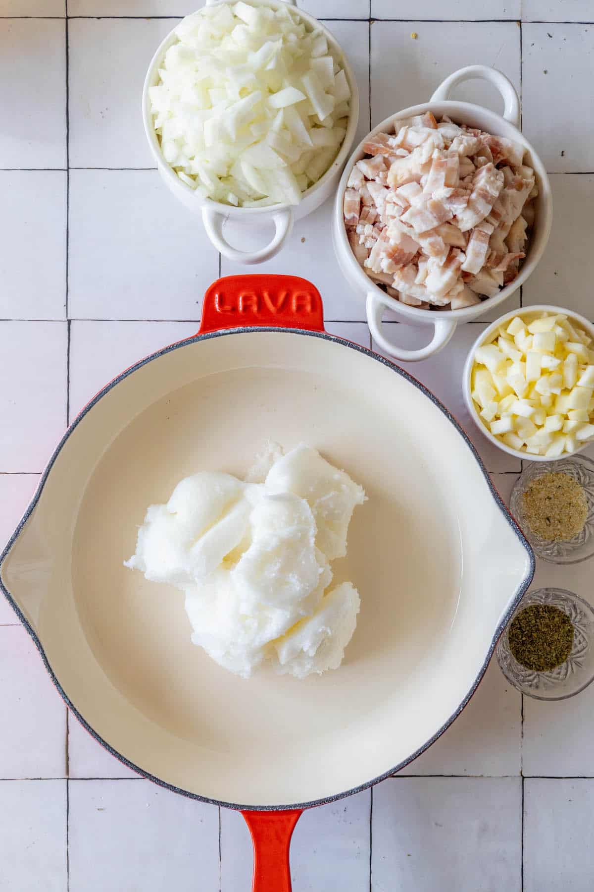 A Polish Smalec spread on a tiled floor.