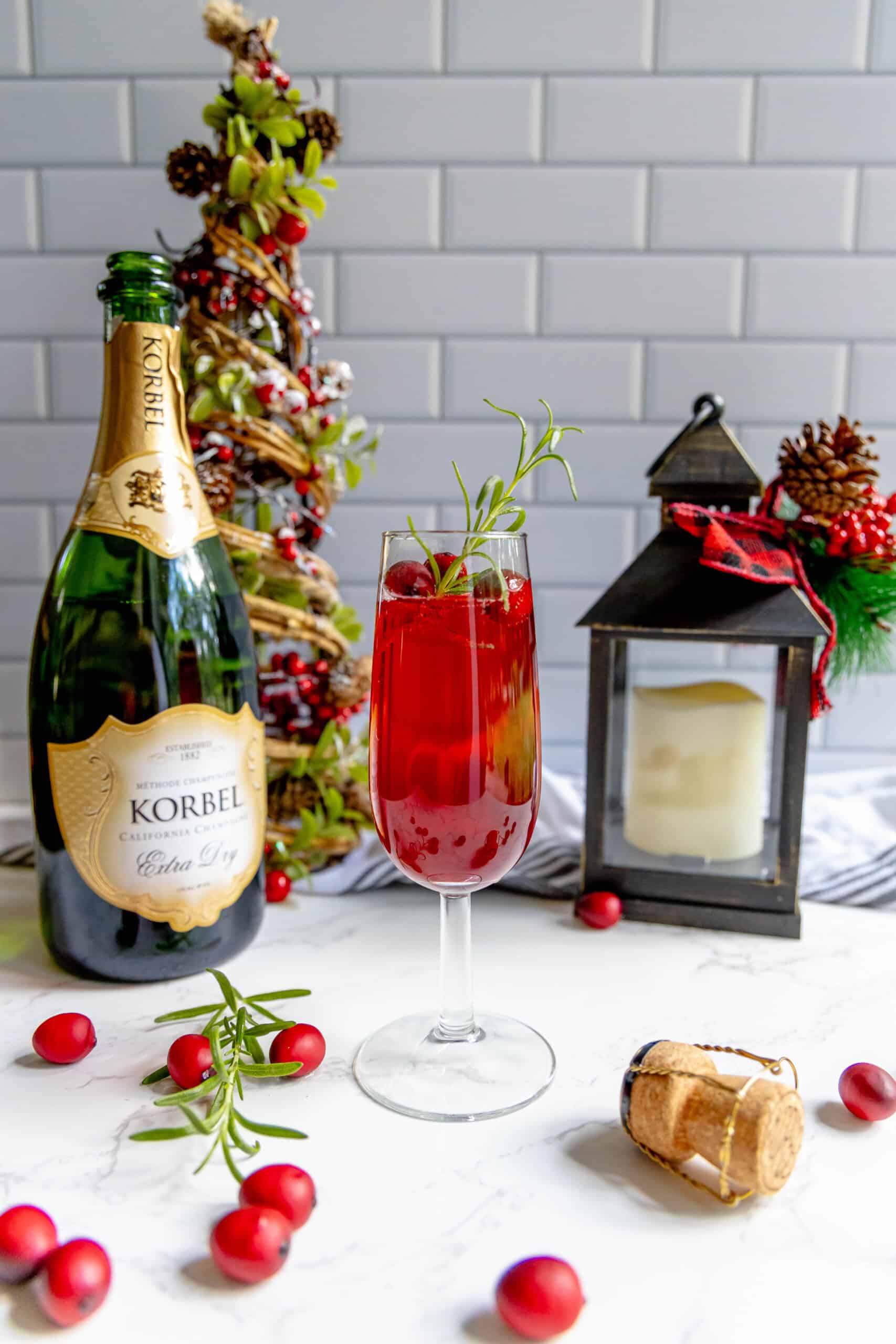 A cranberry champagne sparkler on a table.