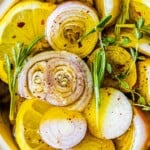 Shallot-infused lemon slices in a bowl.