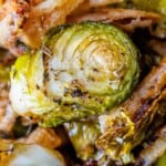 A close up of roasted Brussels sprouts and onions.