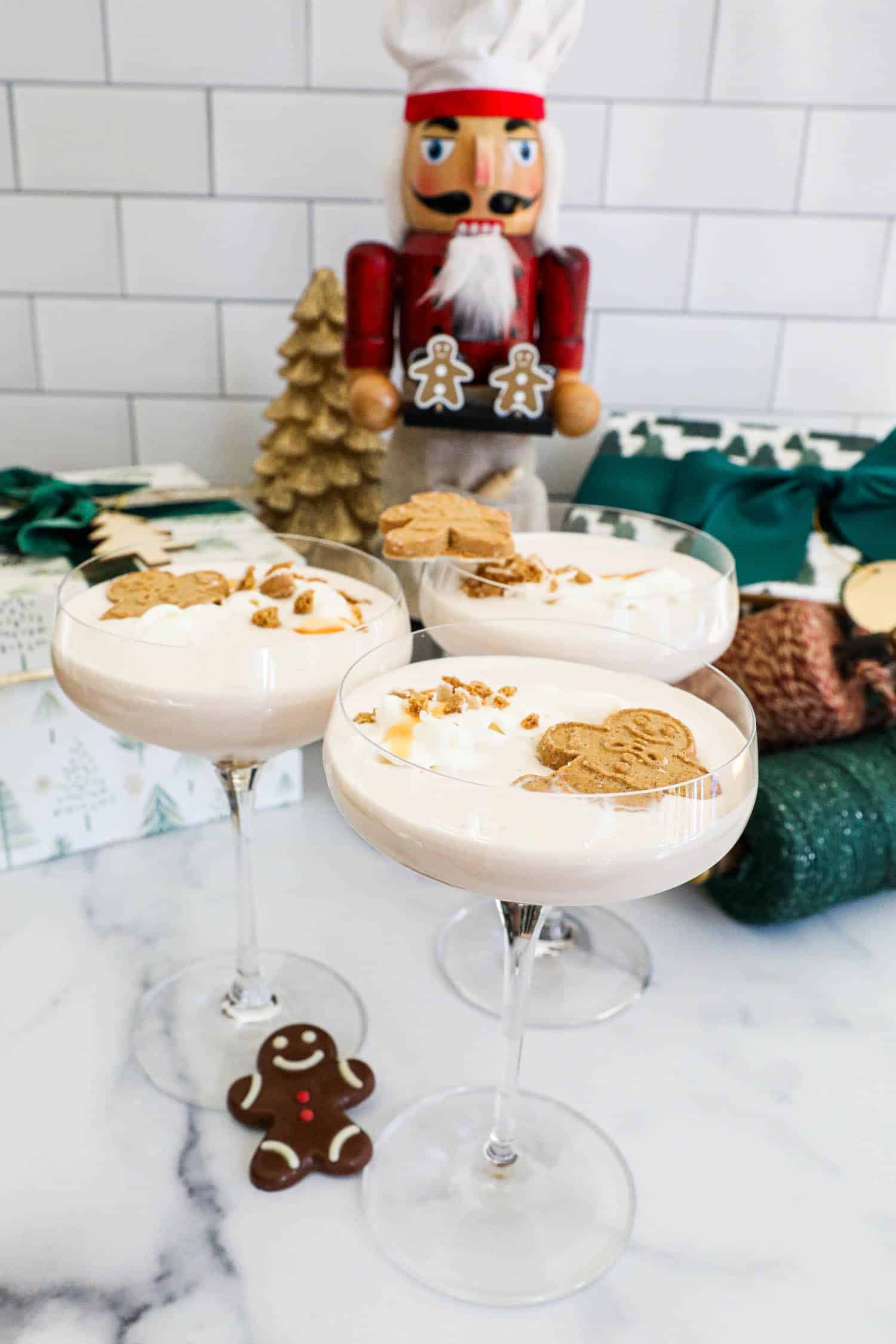 Gingerbread martini with whipped cream and gingerbread cookies.