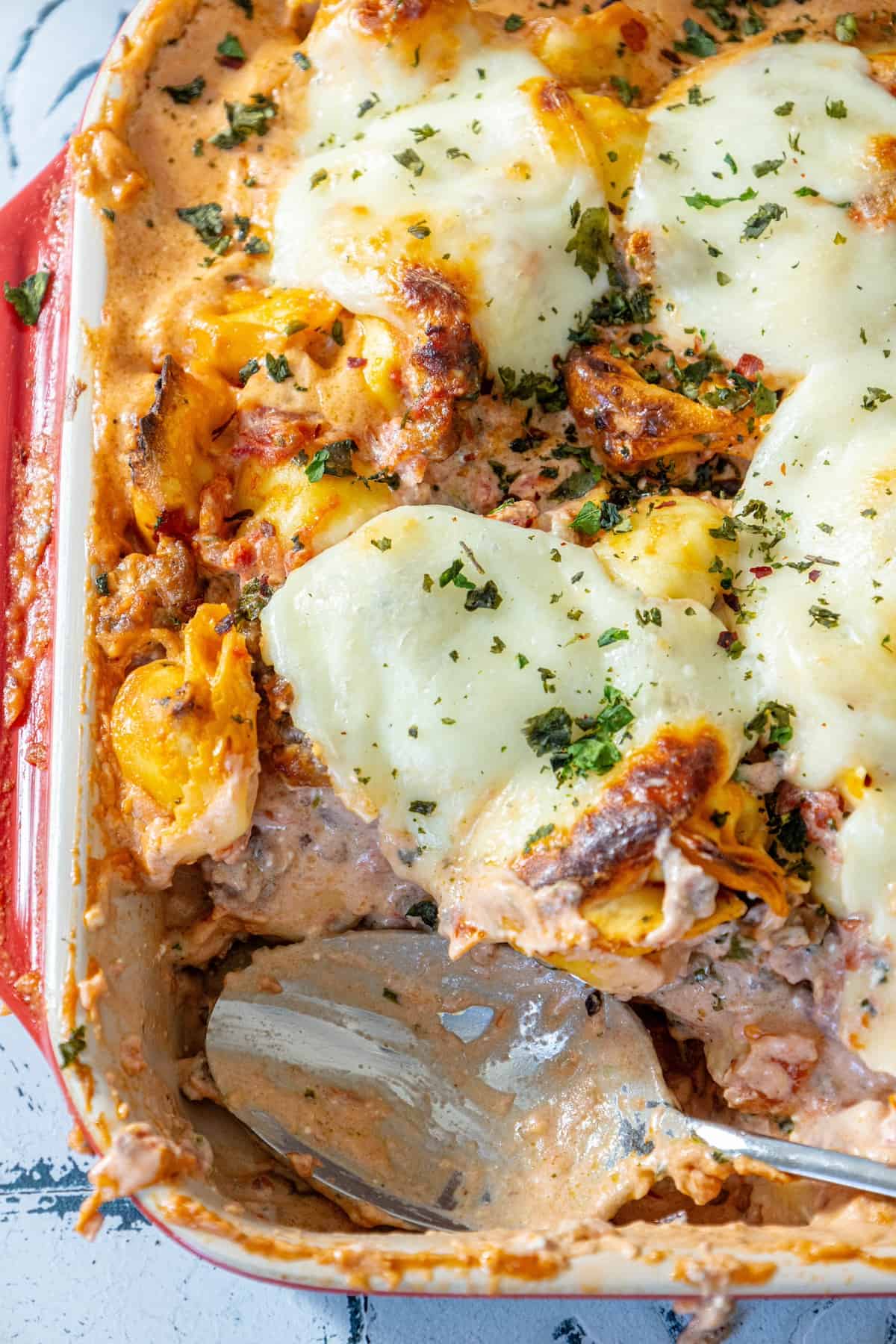 A cheesy casserole bake with tortellini and tomatoes.