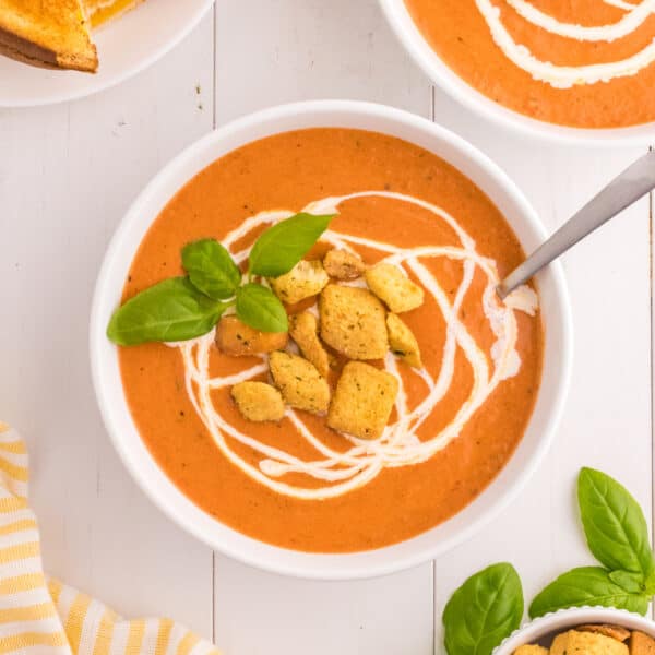 A bowl of tomato soup with croutons and basil. Auto Draft