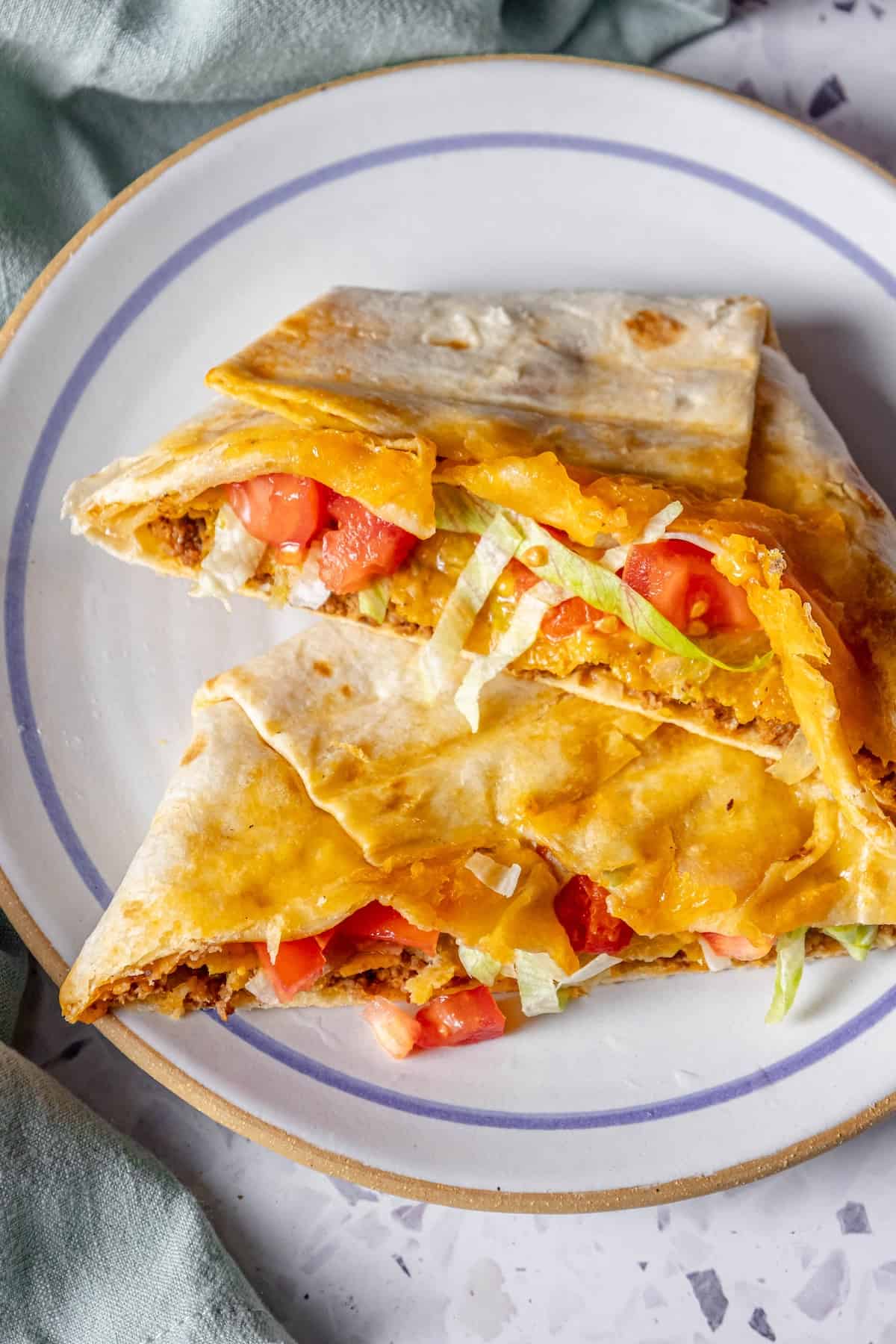 Homemade chicken quesadilla on a plate.