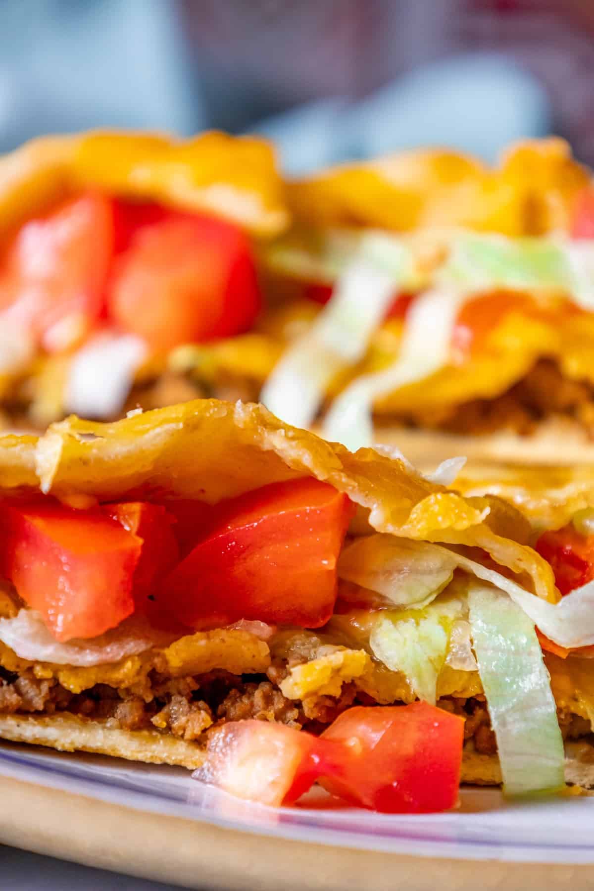 A homemade plate with two CrunchWrap tacos on it.