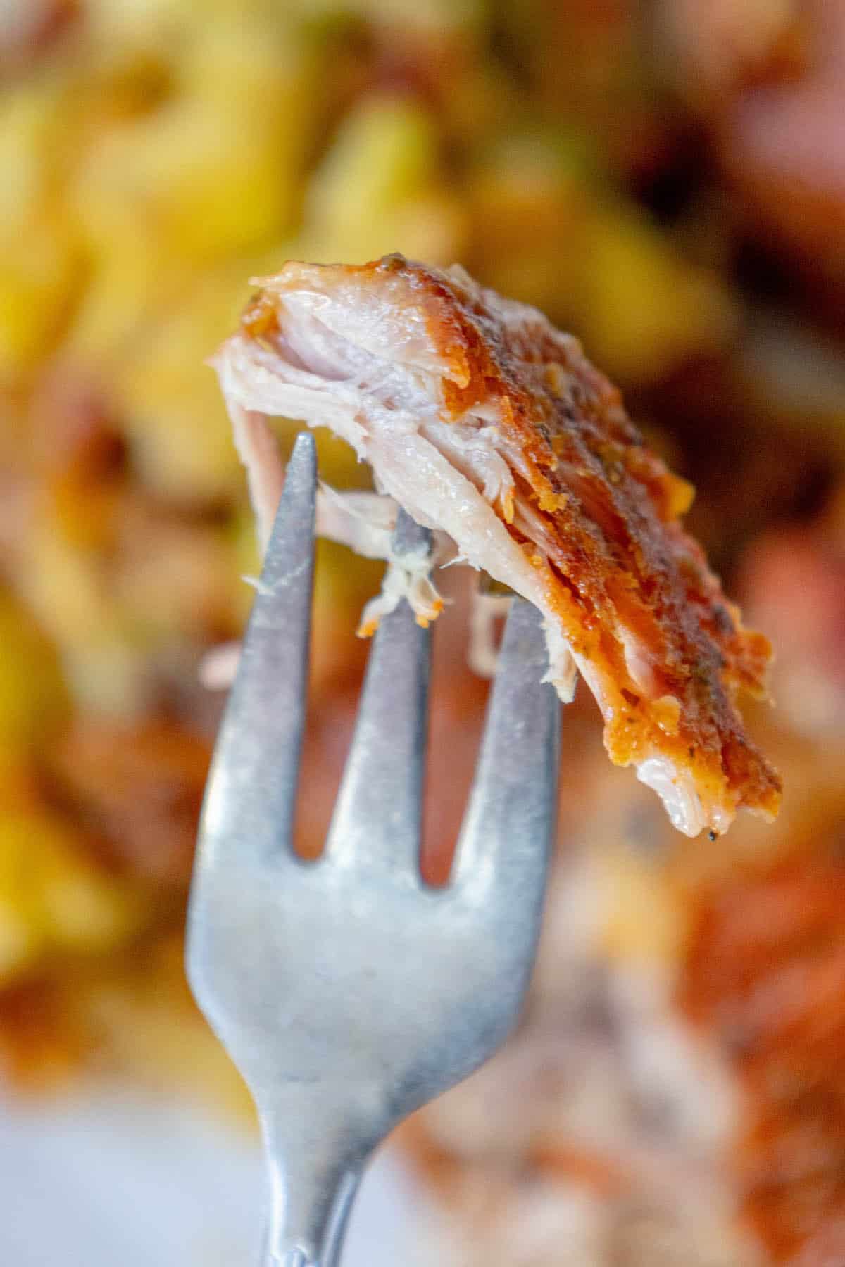A Polish-style fork with a piece of Country Style Ribs on it.