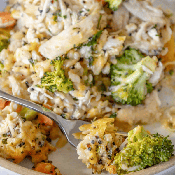 Cheesy chicken and rice casserole with broccoli and carrots.