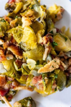 Creamy Brussels sprouts and bacon on a plate.