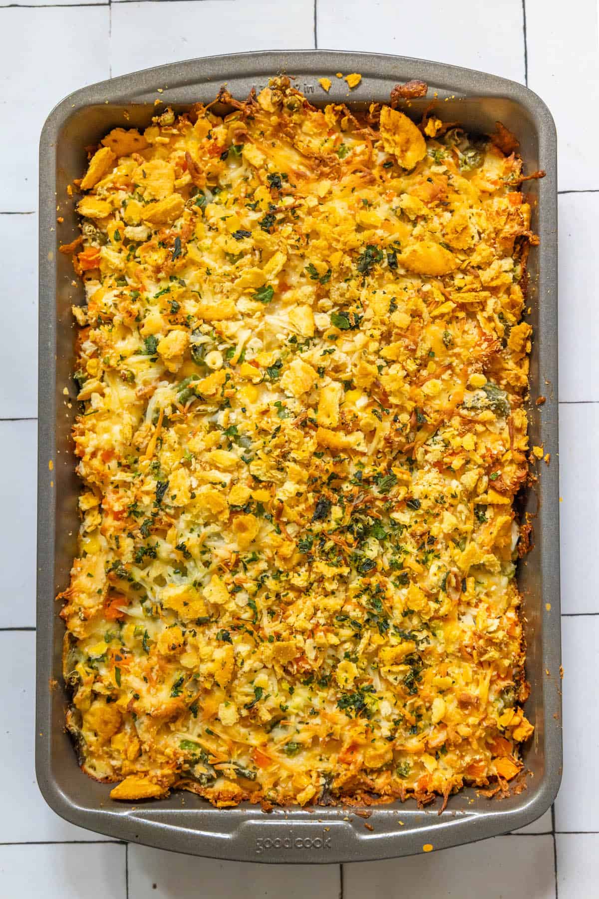 A creamy casserole dish filled with vegetables and herbs.