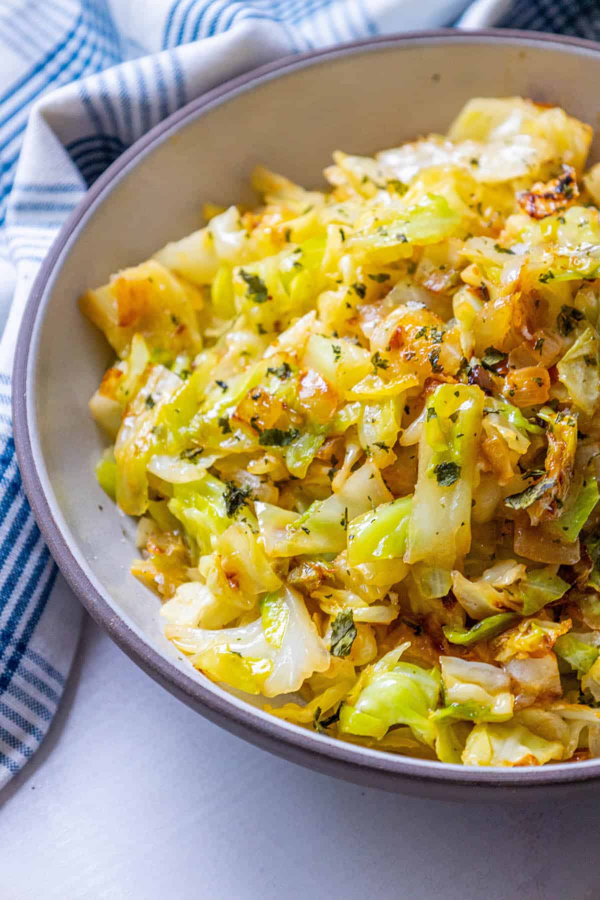 An Easy Caramelized cabbage and onions recipe on a table.