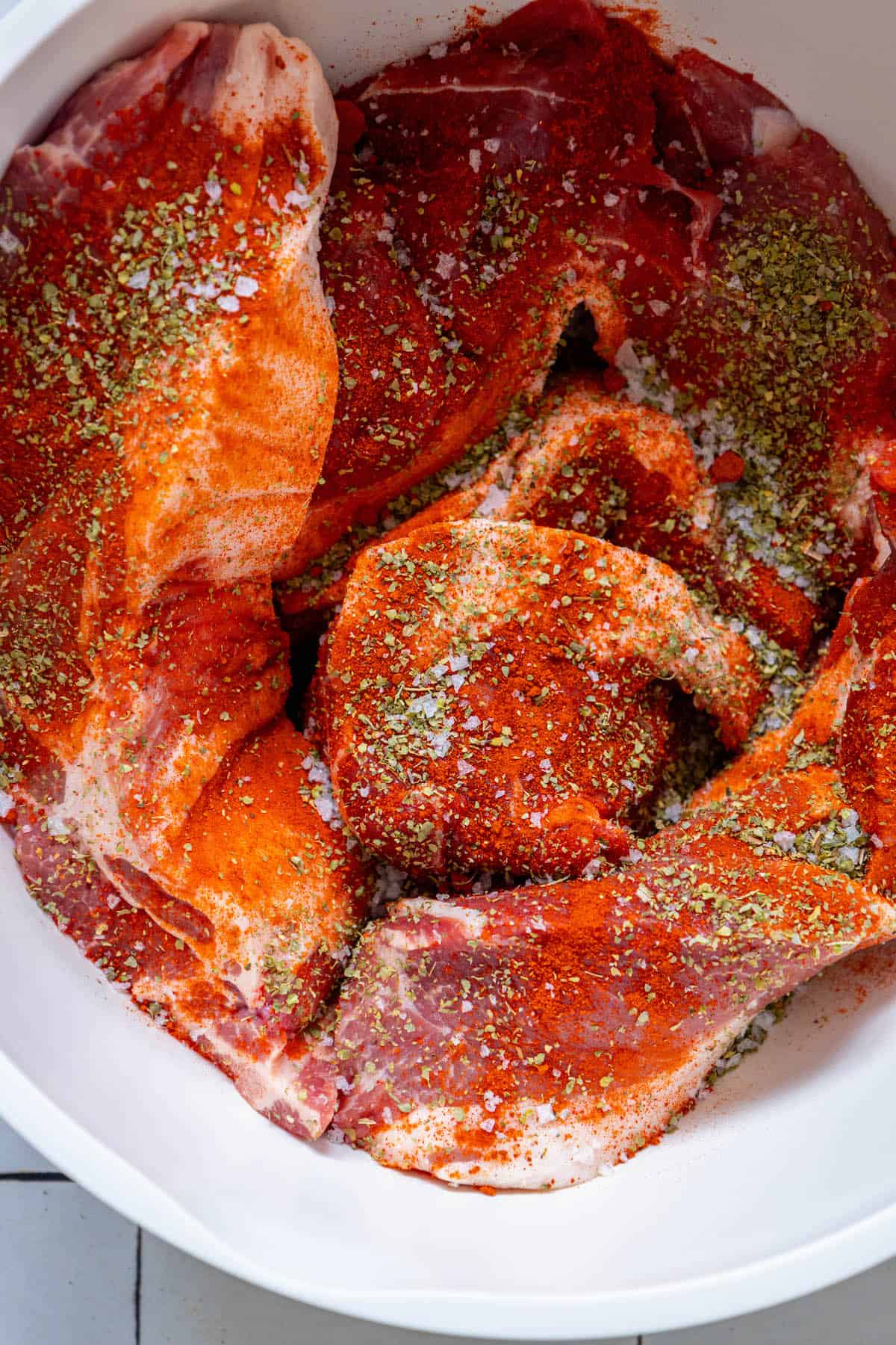 A white bowl with Polish country style ribs in it.
