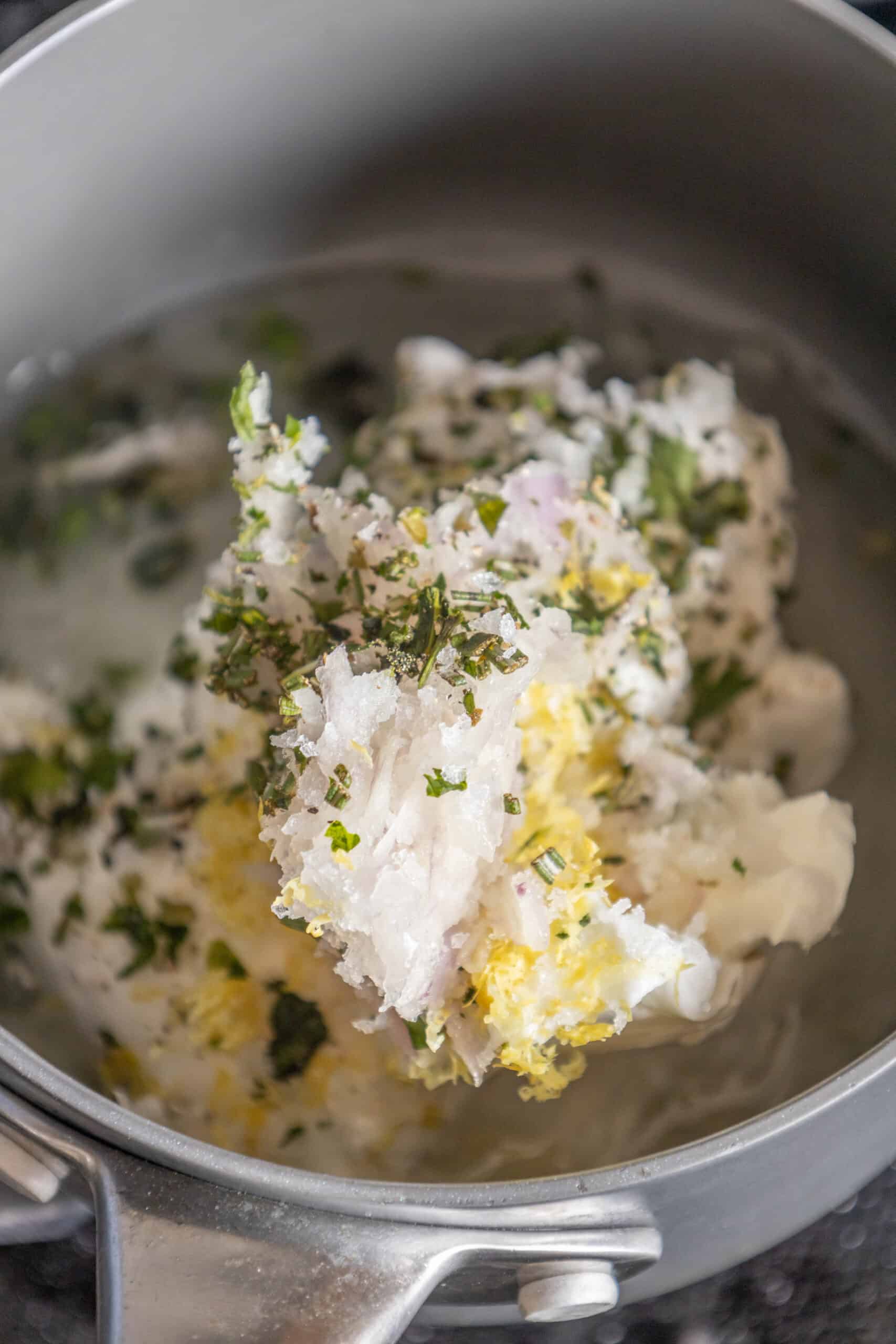 A pan filled with mashed potatoes and tallow candles.