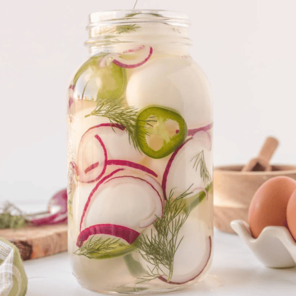 A jar of spicy pickled eggs.