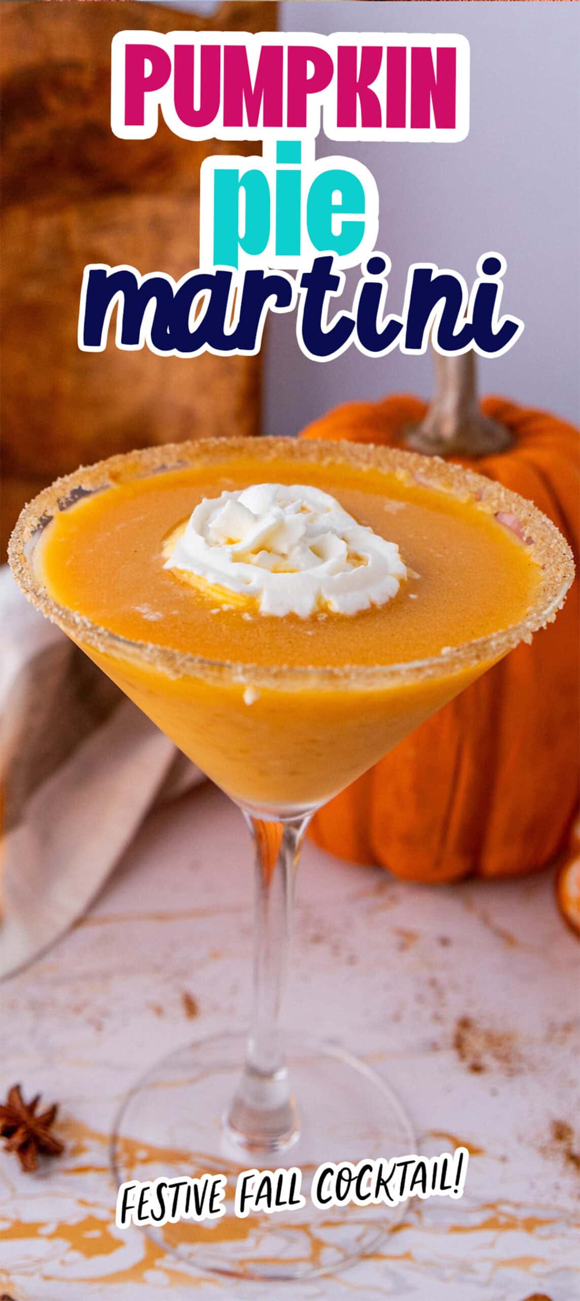 A pumpkin pie martini in a glass with a sugared rim, topped with whipped cream. The text reads "Pumpkin Pie Martini" and "Festive Fall Cocktail!" Decorated with a small pumpkin in the background, this delightful drink captures the essence of autumn.