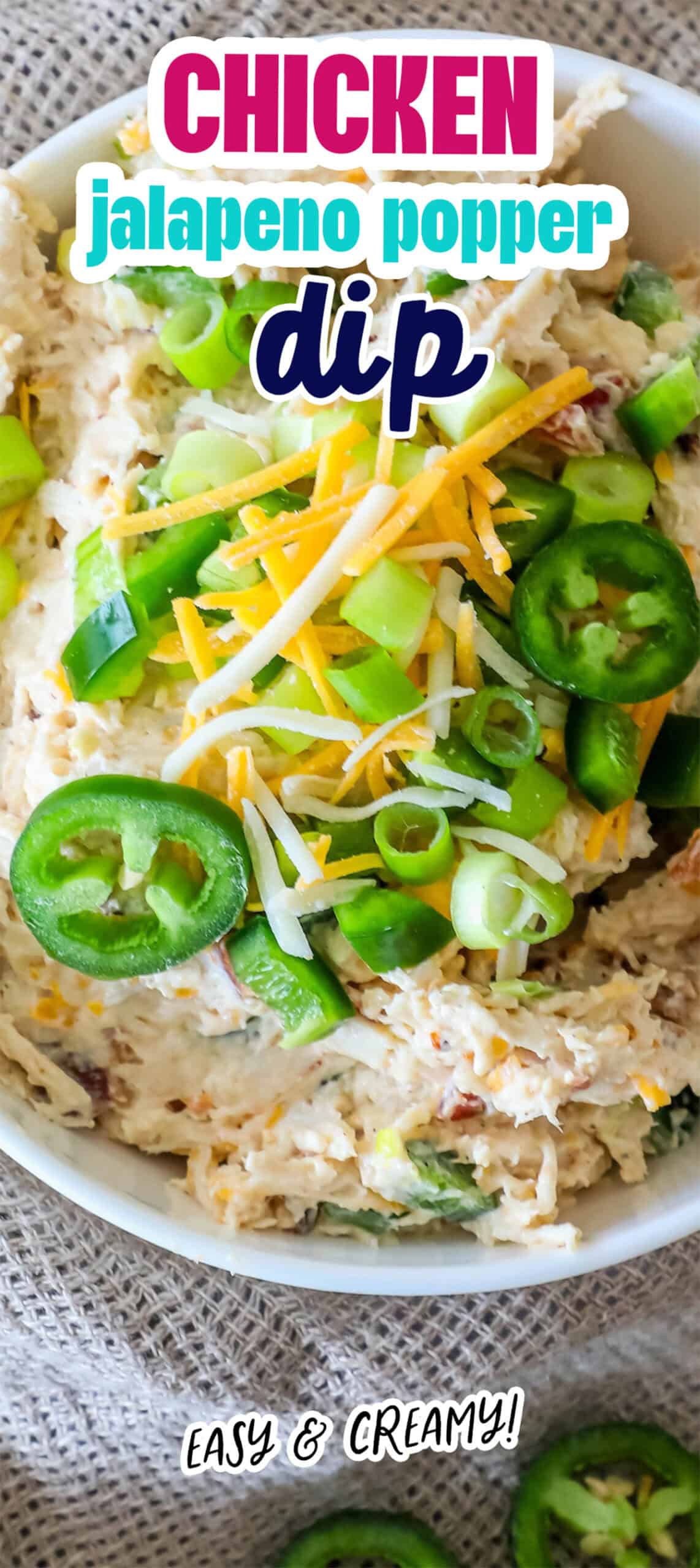 Bowl of chicken jalapeño popper dip topped with sliced jalapeños, green onions, and shredded cheese. Text reads: "Chicken jalapeno popper dip" and "Easy & Creamy!.