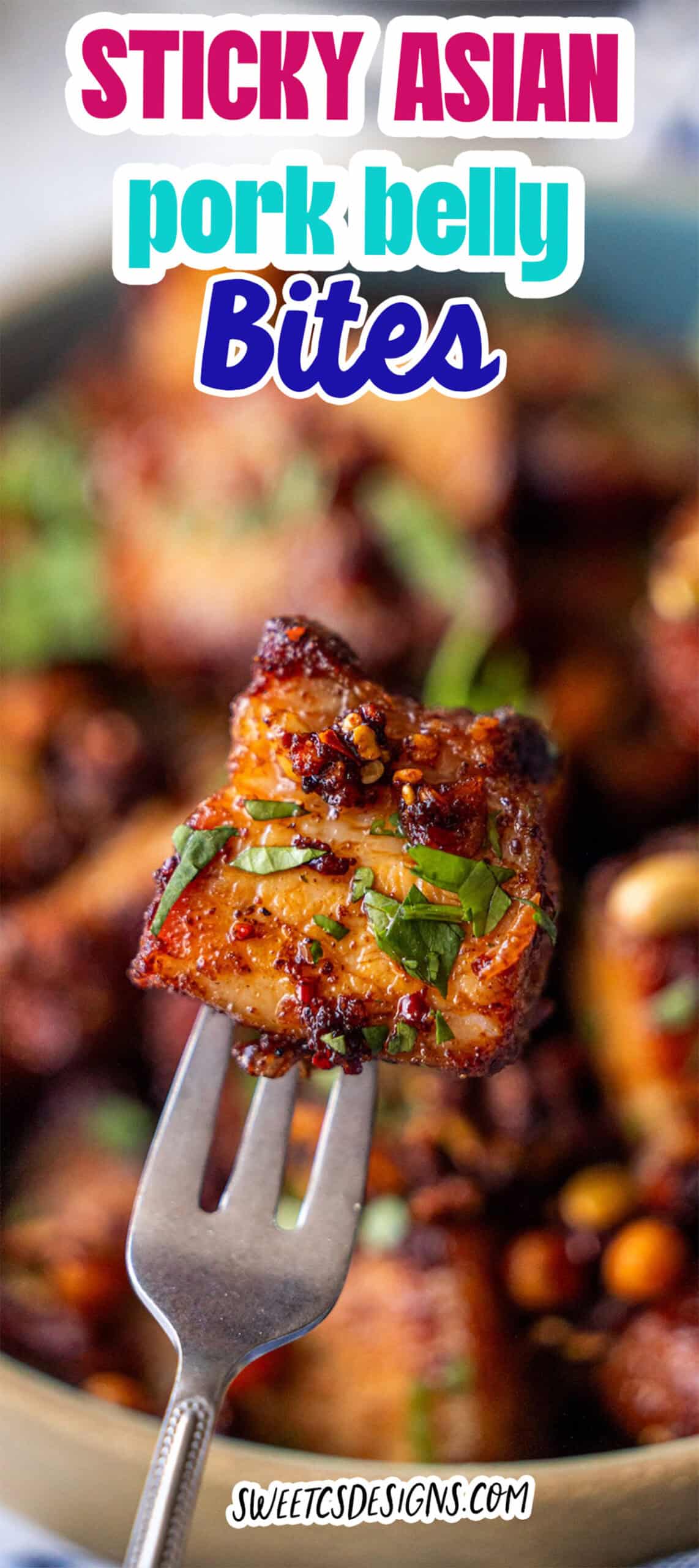 A fork holds a piece of glazed, sticky pork belly bites garnished with herbs, with more pieces blurred in the background. Text reads: "Sticky Asian pork belly bites.