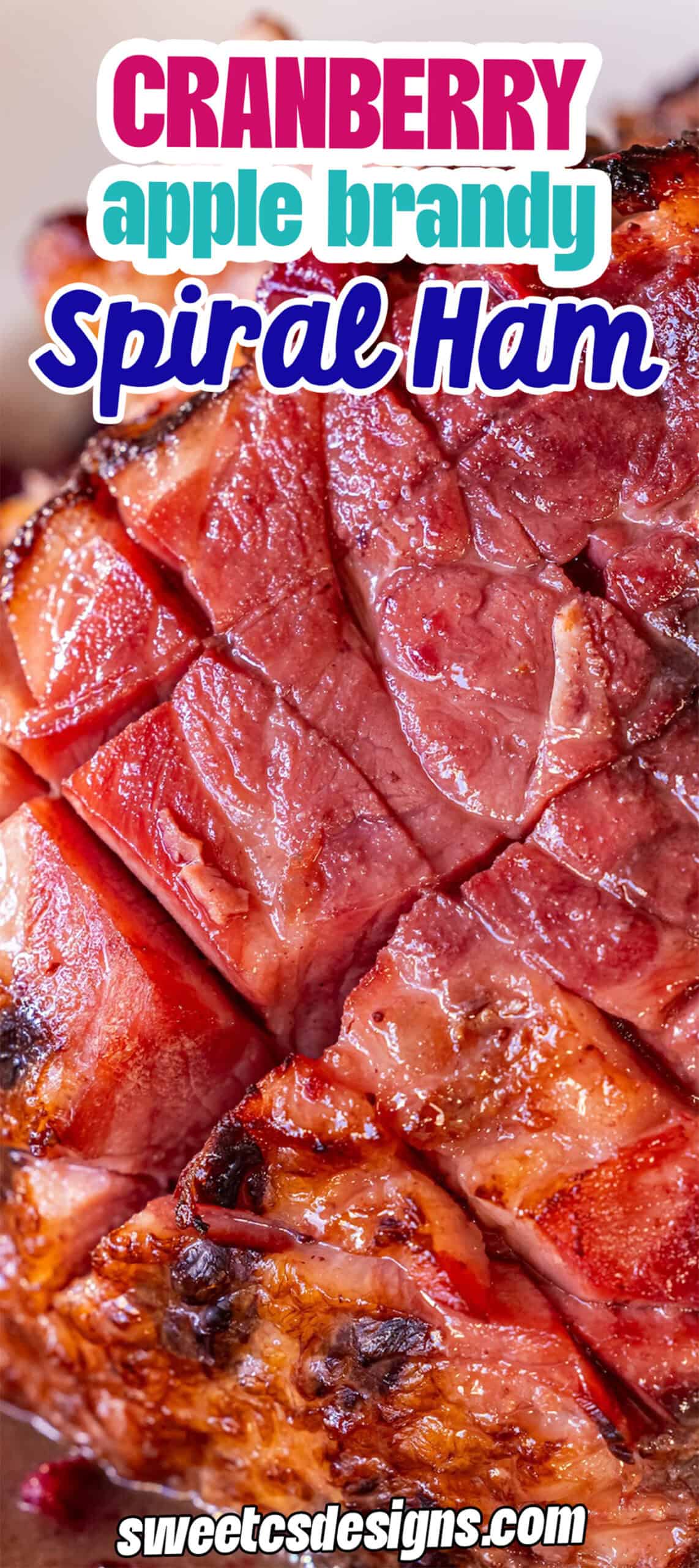 Close-up of a Glazed Spiral Ham with a rich, browned surface. Text overlay reads "Cranberry Brandy spiral ham" and "sweetcsdesigns.com.