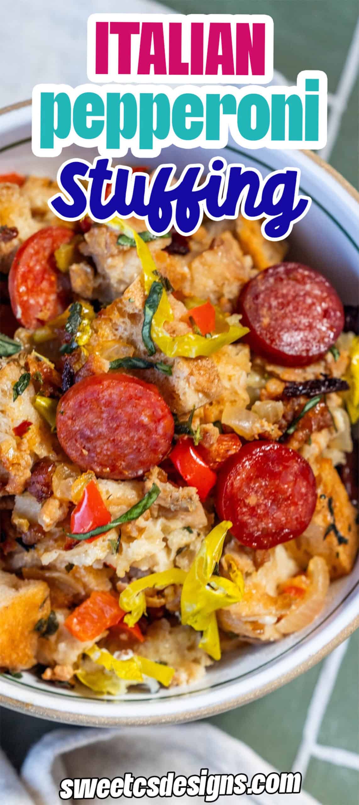 A bowl of savory pepperoni stuffing with bread cubes, herbs, and peppers is placed on a green tiled surface, showcasing classic Italian flavor in every bite.