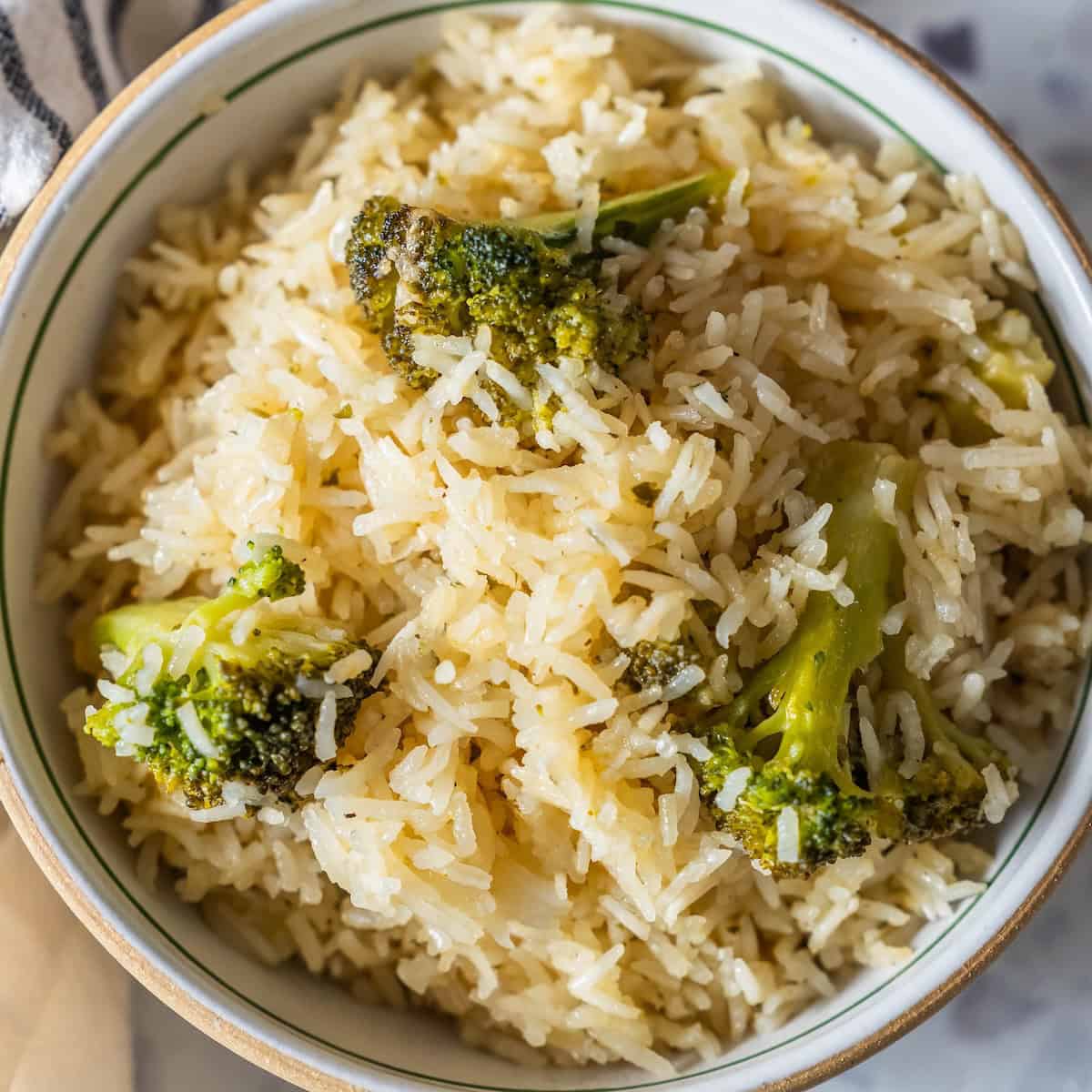 A bowl of Baked Ranch Rice and Broccoli featuring fluffy white rice mixed with tender, steamed broccoli florets.