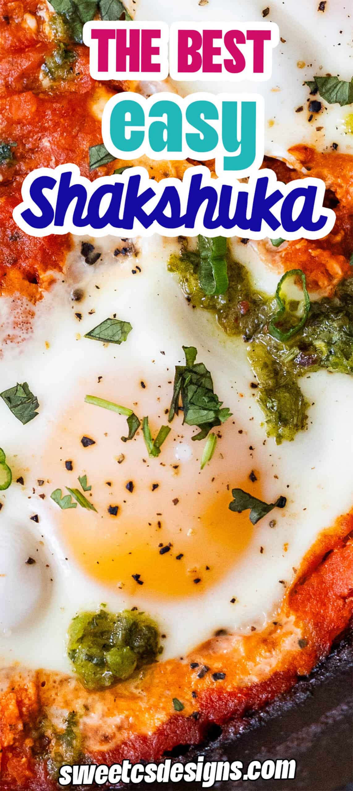 Close-up of shakshuka with baked eggs, tomato sauce, herbs, and green sauce garnish; overlaid text reads "The Best Easy Shakshuka Recipe" and "sweetcsdesigns.com"&mdash;perfect for anyone seeking the best shakshuka for brunch.